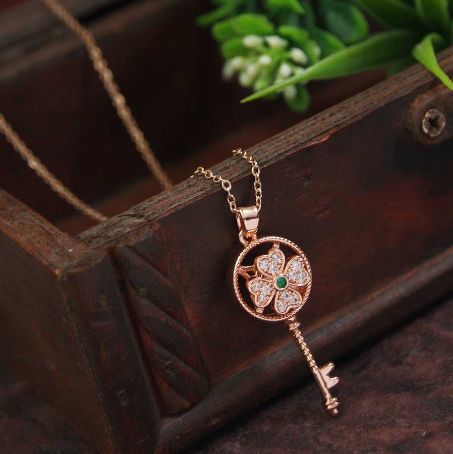 Stainless Steel Gold/Rosegold Plated Spinning Floral Key Shaped Pendent Necklace - SSNK 4316